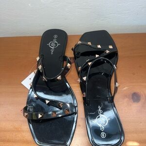 Stylish Black Sandals with Gold Accents